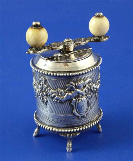 An ornate 19th century French silver drum shaped peppermill, 4in.